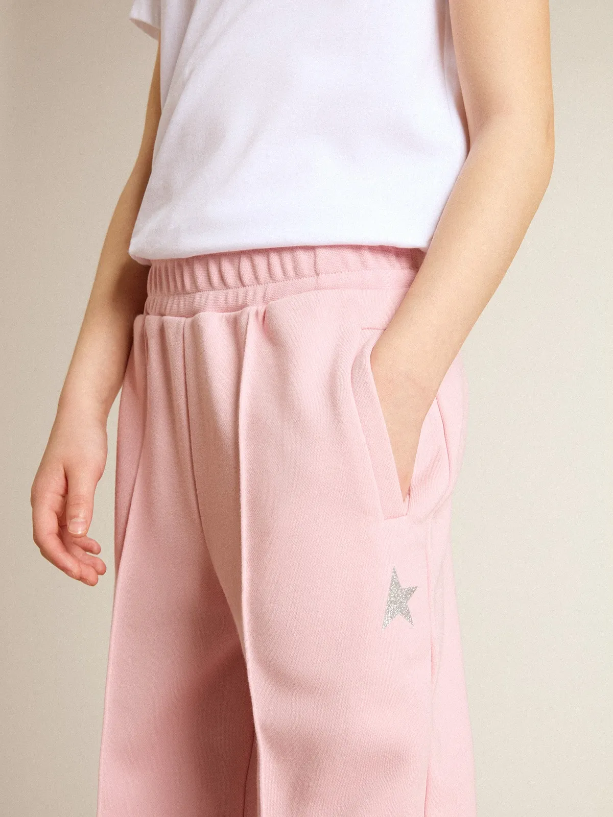 Pantalone jogging rosa con stella in glitter sul davanti