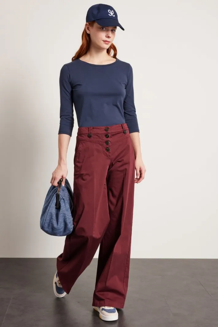 Pantaloni con bottoni a vista