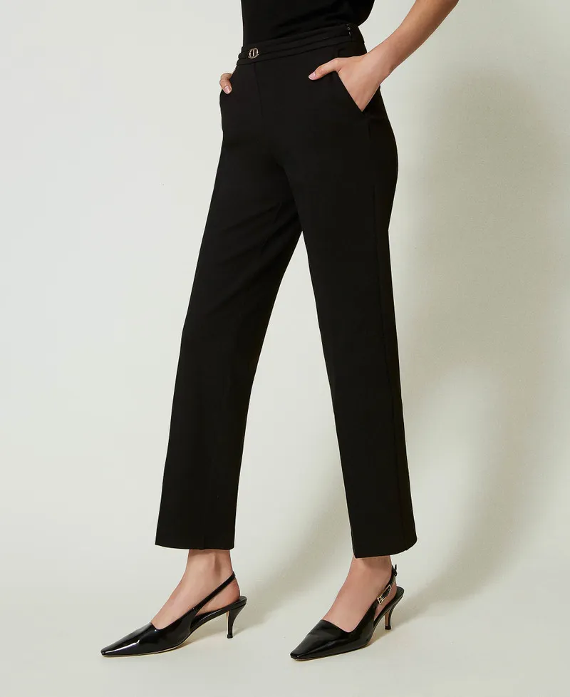 Pantaloni con cinturino Oval T e piega