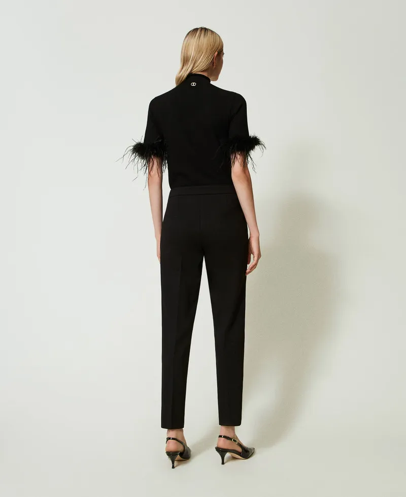 Pantaloni con cinturino Oval T e piega