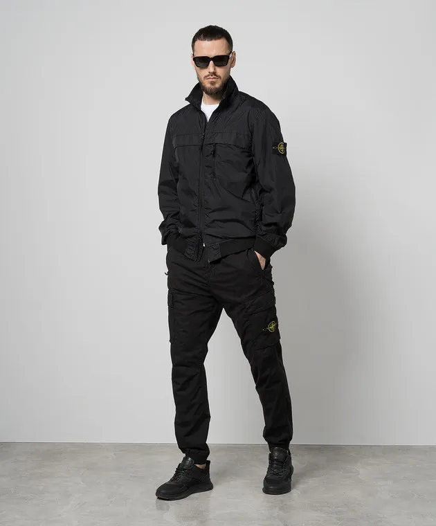 Stone Island Giacca a vento nera con patch logo removibile 801541022